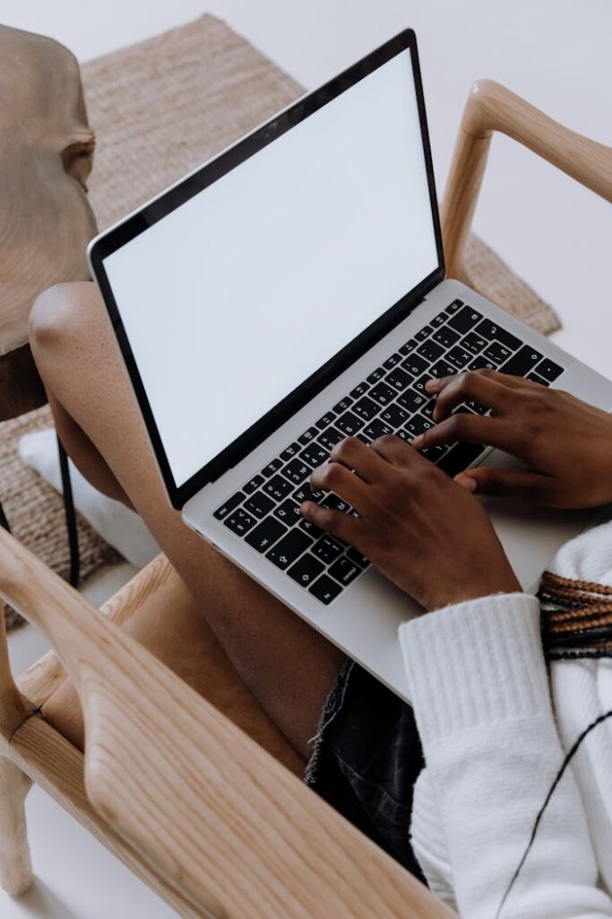 Woman using digital marketing tools on a laptop, provided by Filip Digital to enhance online presence and business growth.